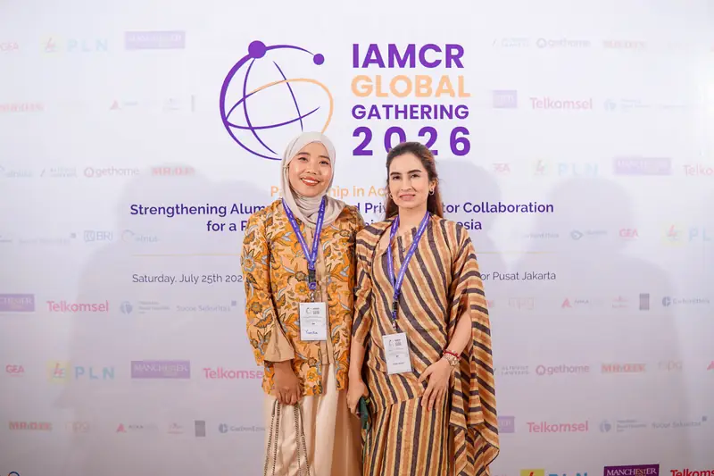 Attendees at the Global Gathering backdrop