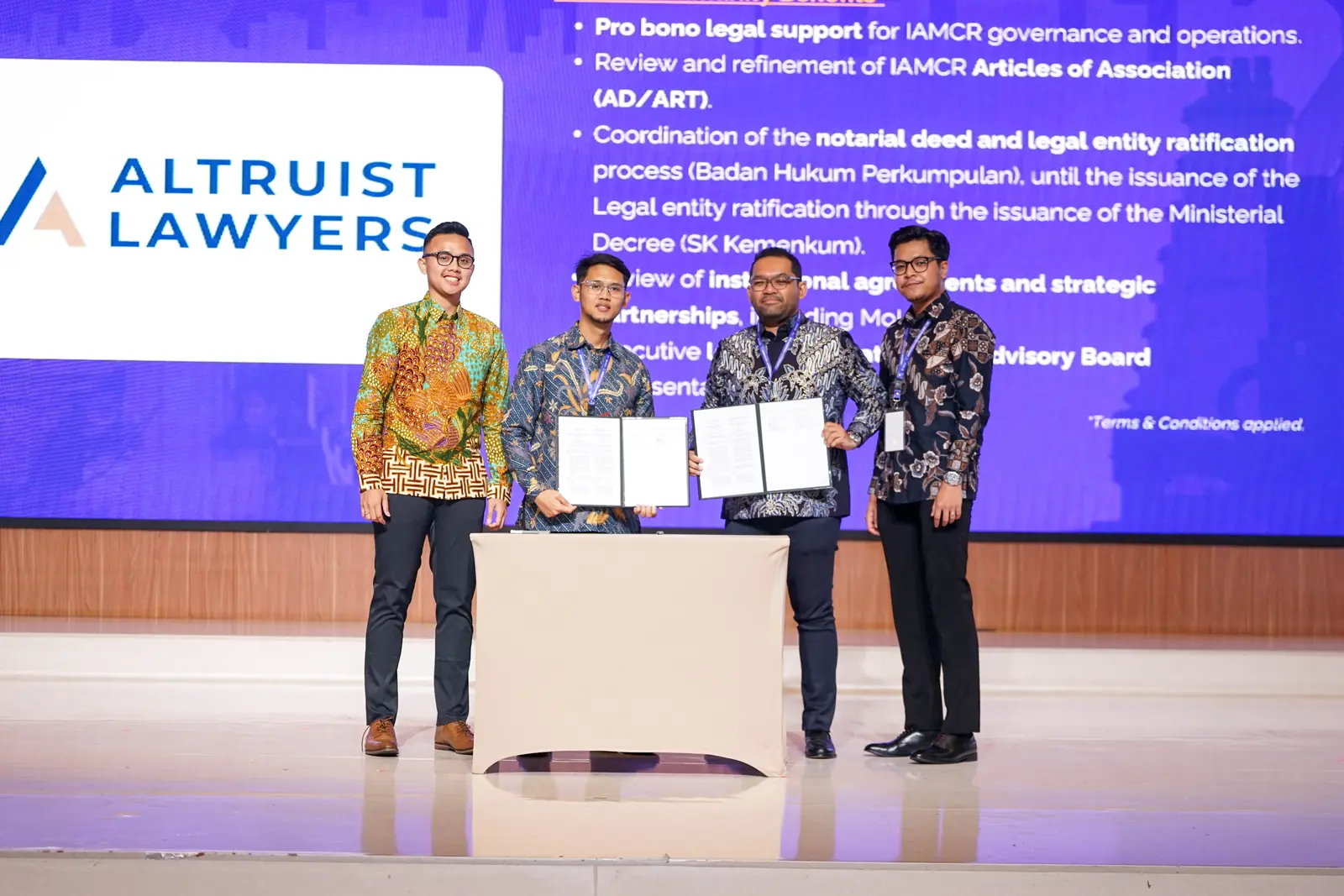 IAMCR and Altruist Lawyers representatives holding the signed MoU