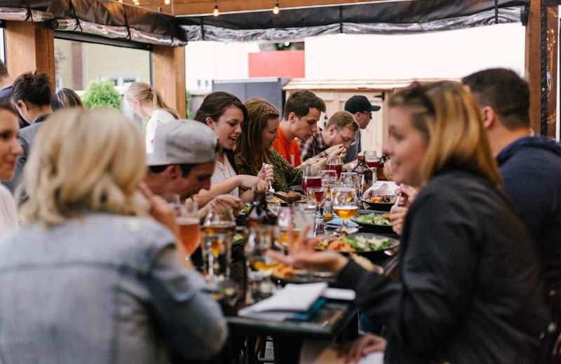 Guests networking at a long table